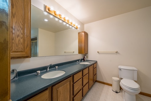 105 Laurel Ln, Sayre, PA 18840 - bathroom with double vanity, baseboards, and toilet