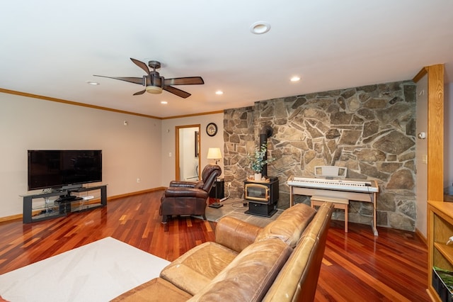 105 Laurel Ln, Sayre, PA 18840 - living area featuring a wood stove, baseboards, ceiling fan, wood finished floors, and crown molding