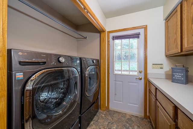 105 Laurel Ln, Sayre, PA 18840 - washroom featuring separate washer and dryer, cabinet space, and dark stone finish flooring