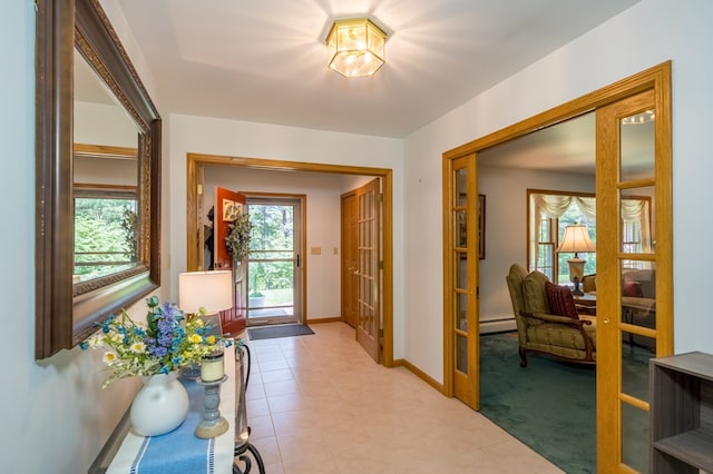 105 Laurel Ln, Sayre, PA 18840 - hall featuring french doors, baseboards, and a baseboard radiator