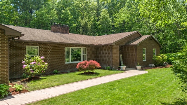 105 Laurel Ln, Sayre, PA 18840 - single story home with a chimney, brick siding, a front yard, and a shingled roof