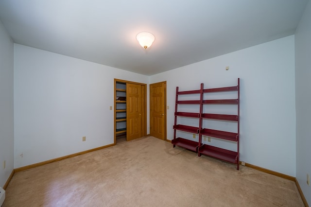 105 Laurel Ln, Sayre, PA 18840 - unfurnished bedroom featuring light carpet, baseboards, and a closet