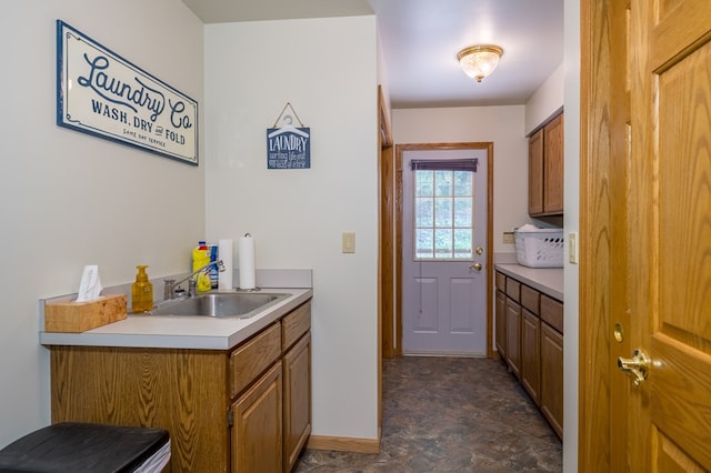 105 Laurel Ln, Sayre, PA 18840 - laundry room with a sink, baseboards, and stone finish floors