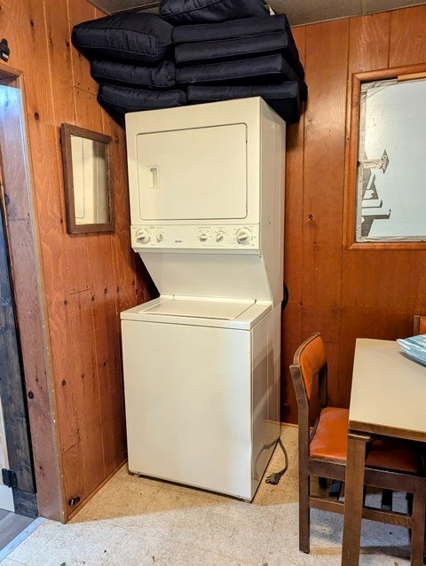 198 Spring Run Rd, Smethport, PA 16749 - washroom featuring estacked washer and dryer, wood walls, and light flooring