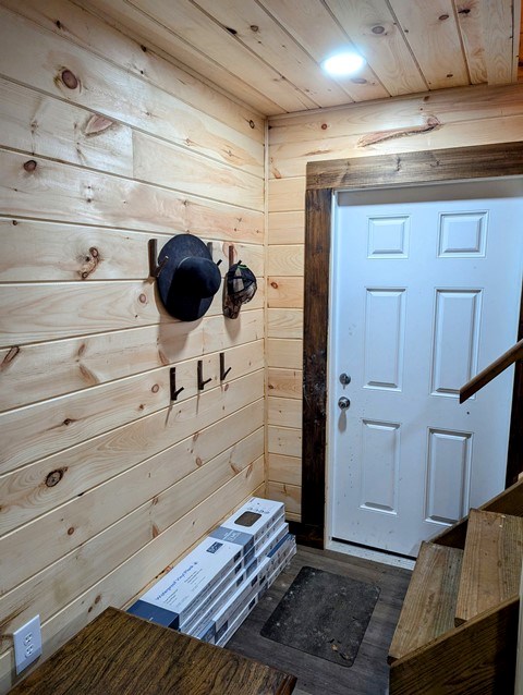198 Spring Run Rd, Smethport, PA 16749 - entrance foyer featuring wood walls, wood finished floors, and wood ceiling