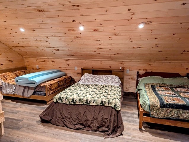 198 Spring Run Rd, Smethport, PA 16749 - bedroom featuring wood ceiling, wood finished floors, wooden walls, and vaulted ceiling