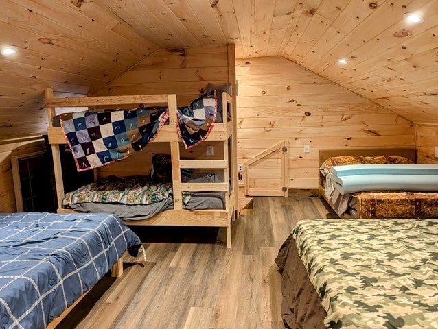 198 Spring Run Rd, Smethport, PA 16749 - bedroom with lofted ceiling, wooden ceiling, wooden walls, wood finished floors, and recessed lighting