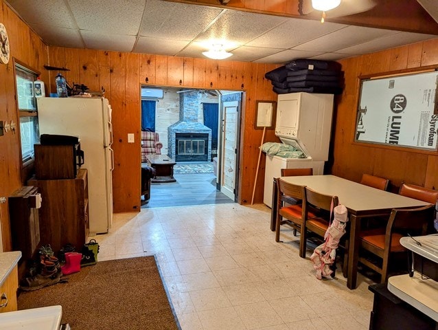 198 Spring Run Rd, Smethport, PA 16749 - dining area featuring wooden walls, light flooring, a drop ceiling, and an AC wall unit