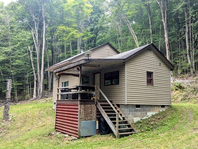 198 Spring Run Rd, Smethport, PA 16749 - view of front of house featuring crawl space, stairs, and a wooded view