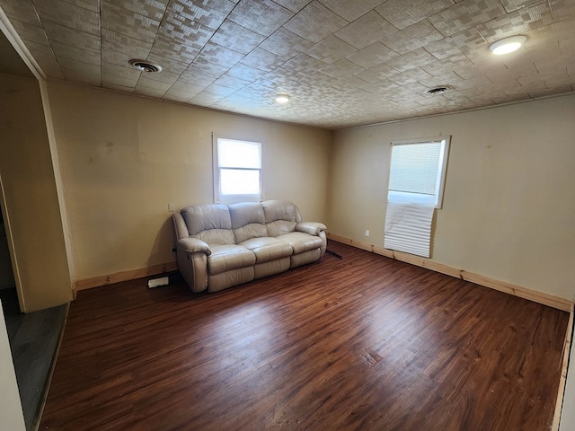 unfurnished living room featuring dark hardwood / wood-style flooring