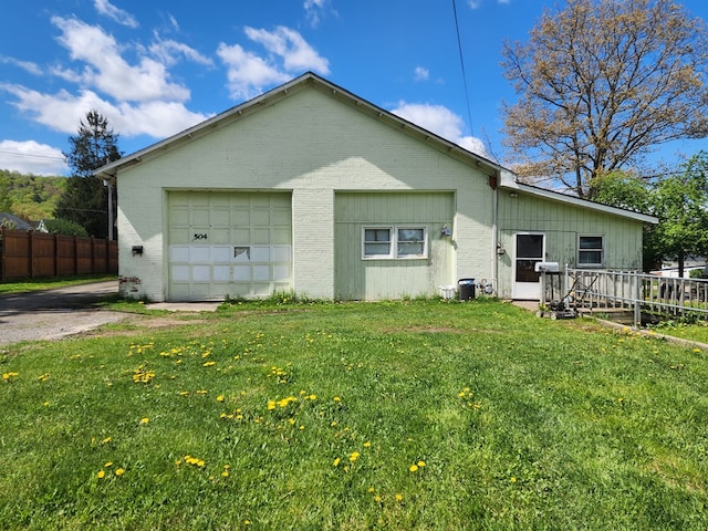 504 S E St, Coudersport, PA 16915 - rear view of property with brick siding and a garage