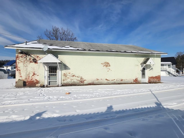 view of snow covered property