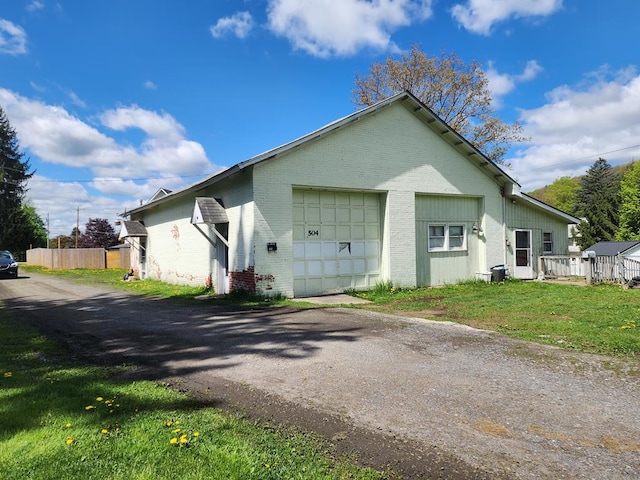 504 S E St, Coudersport, PA 16915 - view of home's exterior featuring brick siding and asphalt driveway