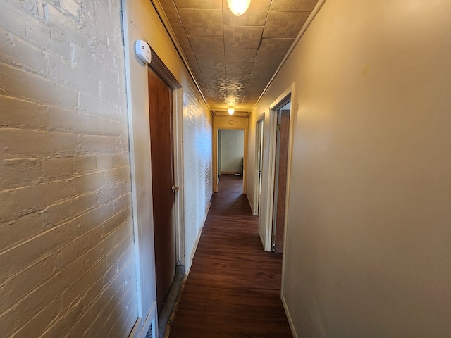 hallway featuring dark hardwood / wood-style flooring