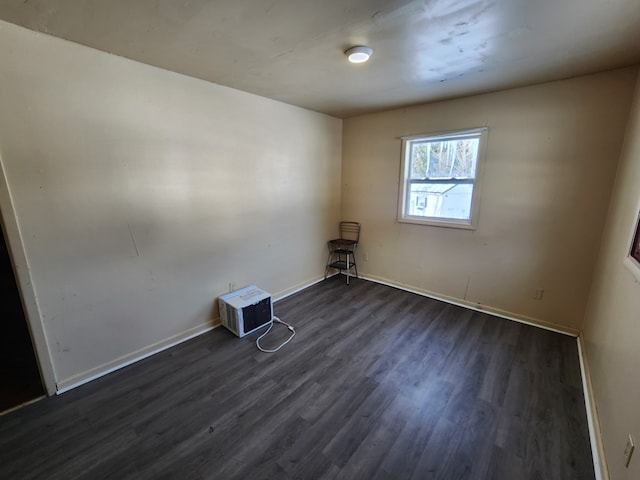 empty room featuring dark hardwood / wood-style floors