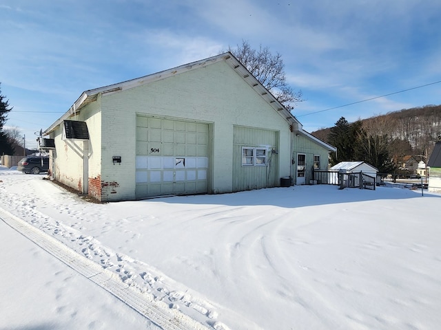 view of snow covered garage