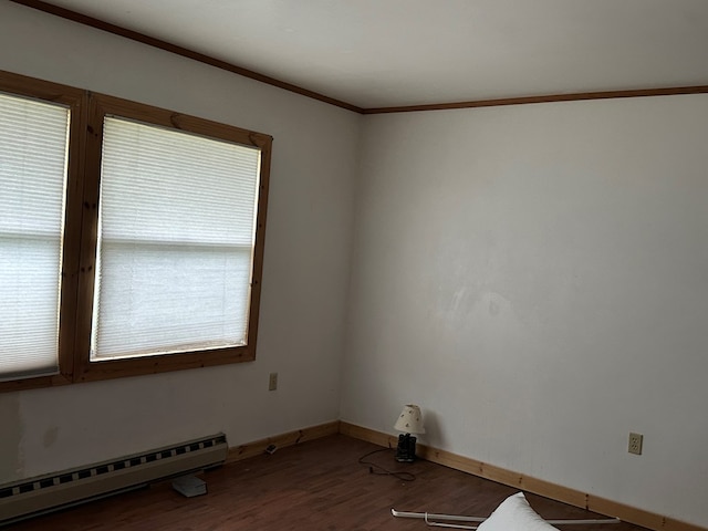 3092 Rte 155, Port Allegany, PA 16743 - empty room with a baseboard radiator, wood finished floors, and ornamental molding