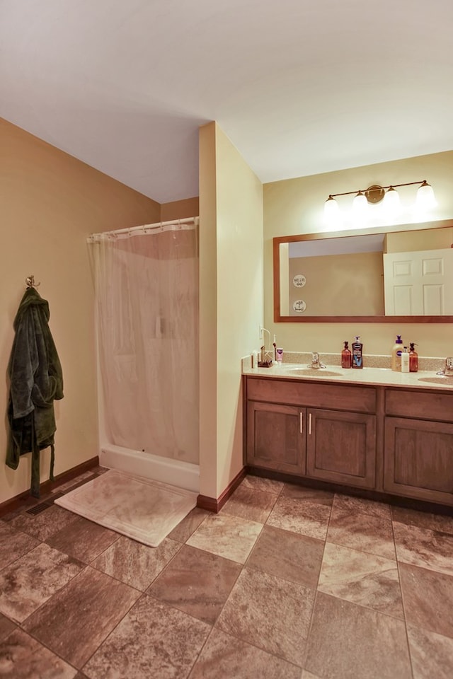 bathroom featuring vanity and a shower with curtain