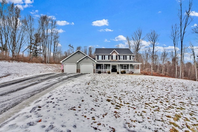 front of property with a porch and a garage