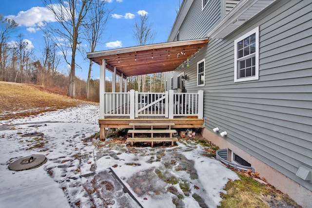 view of snow covered deck