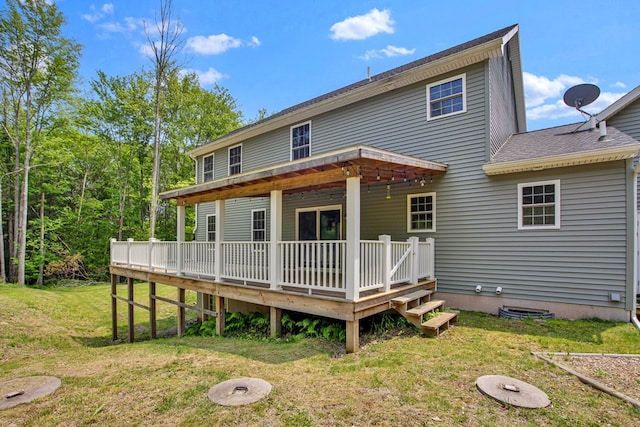5 Sylvan Glen Rd, Wellsboro, PA 16901 - back of property featuring a lawn, a shingled roof, and a deck