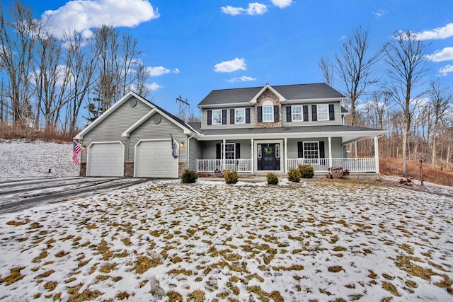 view of front of house with a garage and a porch