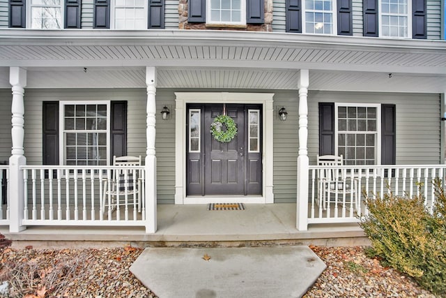 property entrance with covered porch