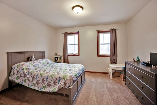 bedroom with light carpet