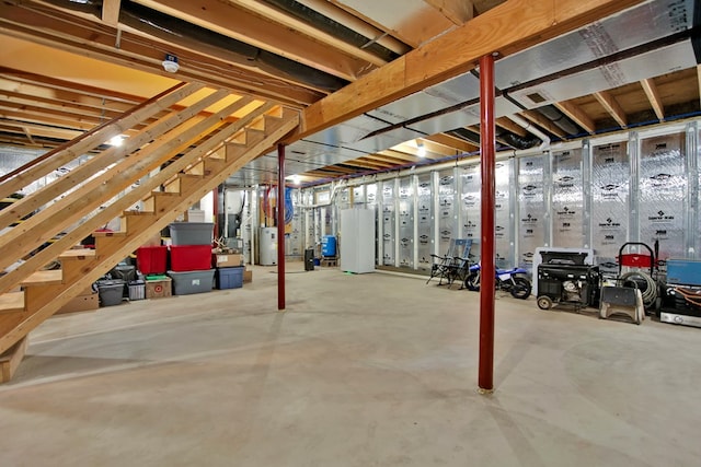 basement featuring white fridge