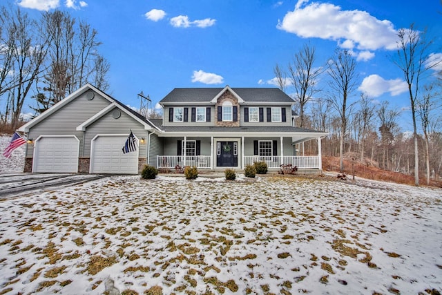 view of front of home featuring covered porch and a garage