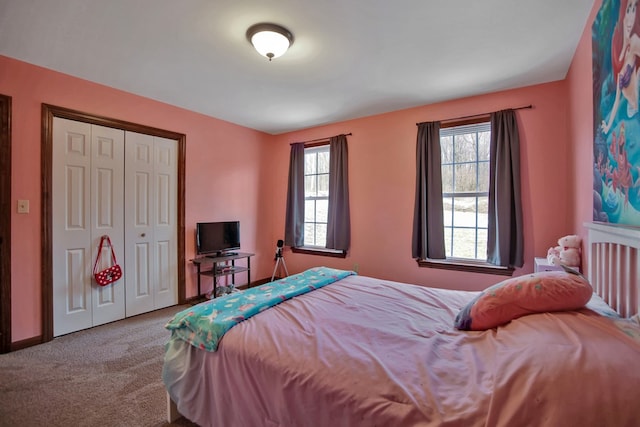 carpeted bedroom with a closet