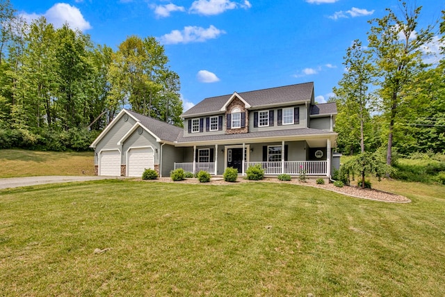 5 Sylvan Glen Rd, Wellsboro, PA 16901 - colonial inspired home with covered porch, a garage, asphalt driveway, and a front yard