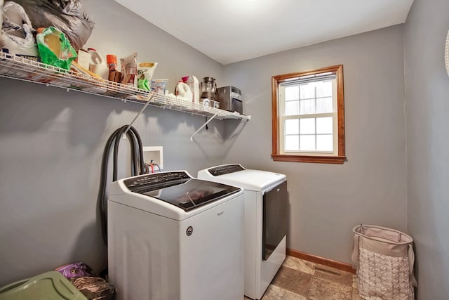 laundry room featuring separate washer and dryer