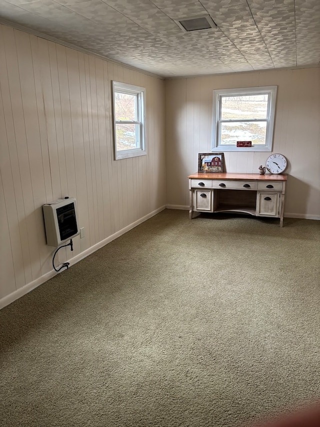 interior space featuring baseboards and heating unit