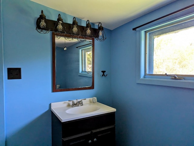 bathroom with vanity and a healthy amount of sunlight