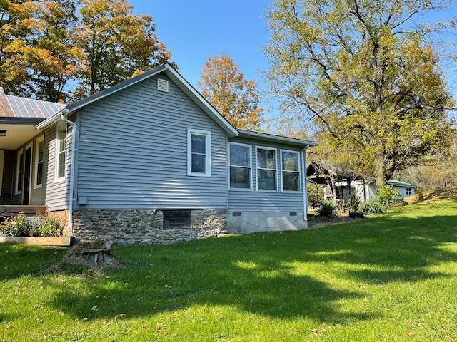 view of property exterior featuring a yard