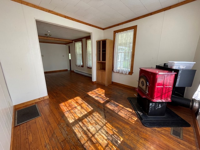 interior space with a baseboard radiator, ornamental molding, dark hardwood / wood-style flooring, and a wood stove