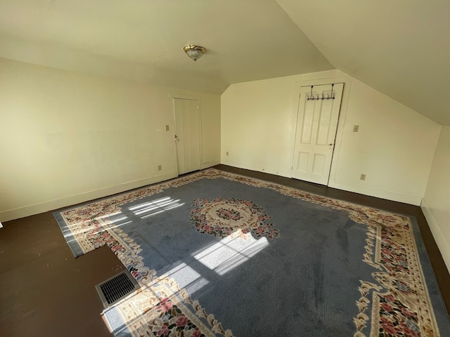 additional living space with lofted ceiling