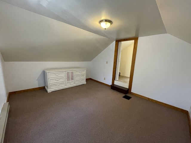 bonus room with lofted ceiling, carpet, and baseboard heating