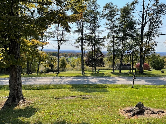 view of basketball court with a yard