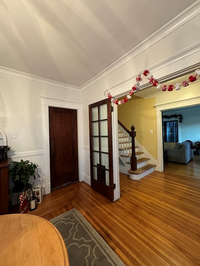 foyer featuring stairway and dark wood finished floors