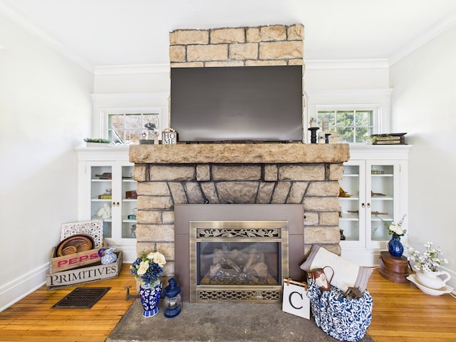 1010 W Main St, Smethport, PA 16749 - details featuring crown molding, wood finished floors, a stone fireplace, and visible vents