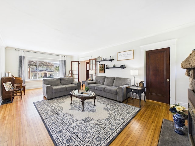 1010 W Main St, Smethport, PA 16749 - living room featuring baseboards and light wood finished floors