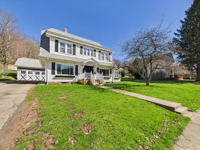 1010 W Main St, Smethport, PA 16749 - view of front of home featuring a front lawn, roof with shingles, and a chimney