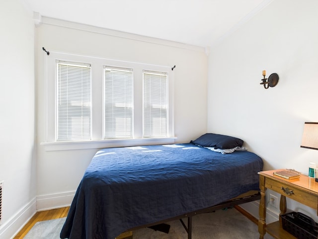 1010 W Main St, Smethport, PA 16749 - bedroom with baseboards, ornamental molding, and wood finished floors