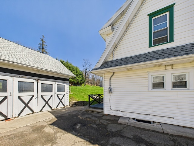 1010 W Main St, Smethport, PA 16749 - view of side of property featuring an outdoor structure and a shingled roof