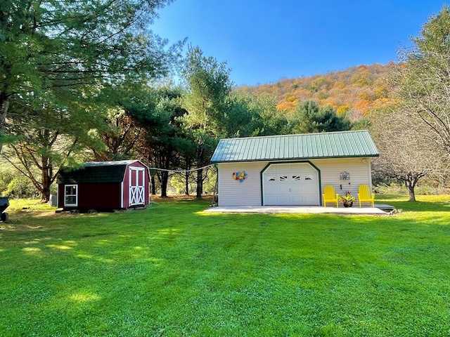 garage featuring a yard