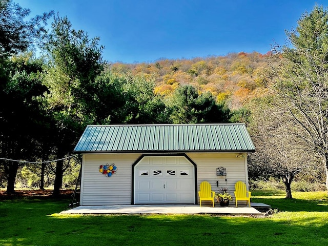 garage with a yard