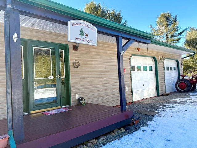 view of snow covered garage