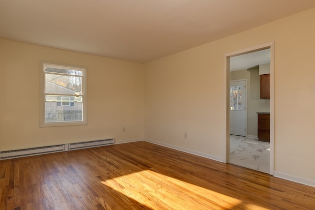 303 E Sullivanville Rd, Horseheads, NY 14845 - unfurnished room with a baseboard radiator and hardwood / wood-style flooring